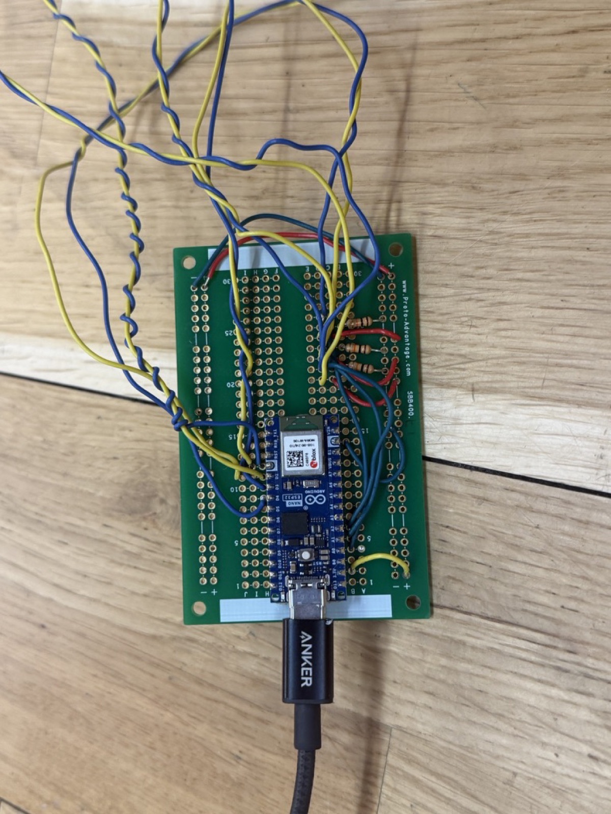 Close-up of the round-two primary circuit: an Arduino Nano ESP32 wired on a prototyping shield